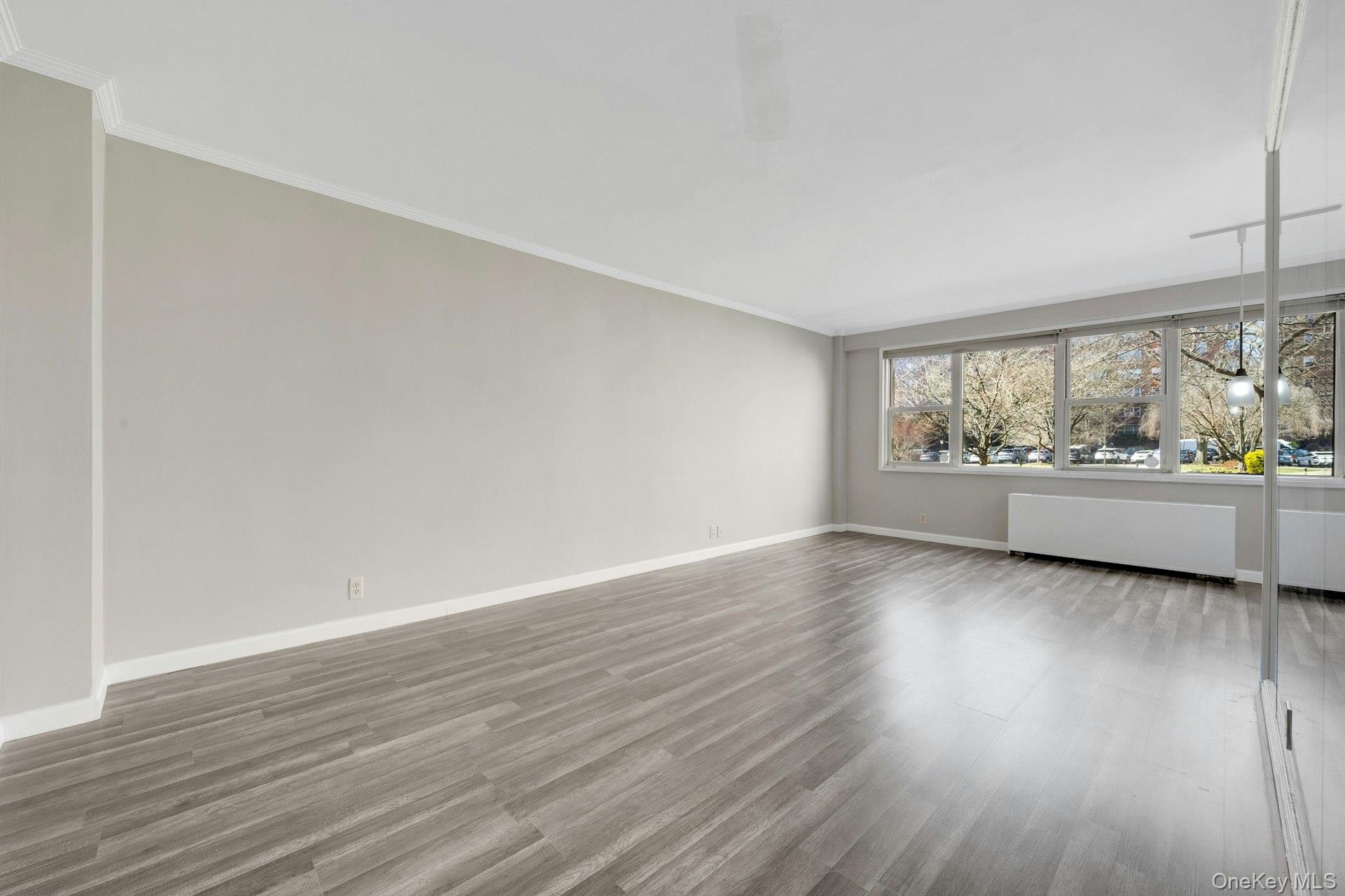 240 Garth Road, Unit 2G2 Scarsdale, NY 10583 - Photo 5 of 25 Living room with wall of windows