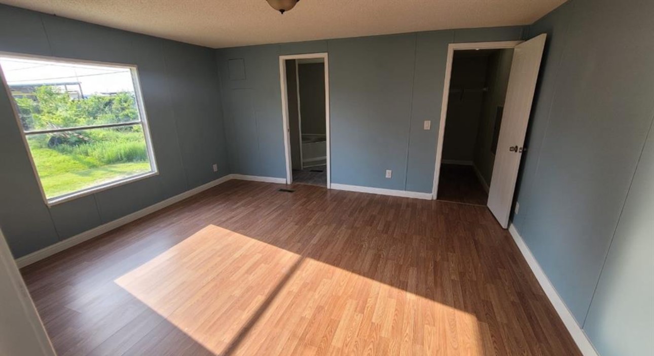 1403 Old Greens Road Houston, TX 77032 - Photo 13 of 19 a view of an empty room and wooden floor