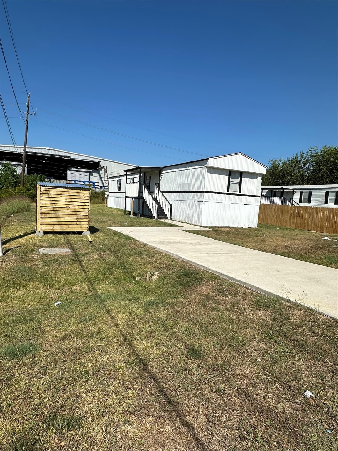 1403 Old Greens Road Houston, TX 77032 - Photo 19 of 19 a view of a yard with wooden fence