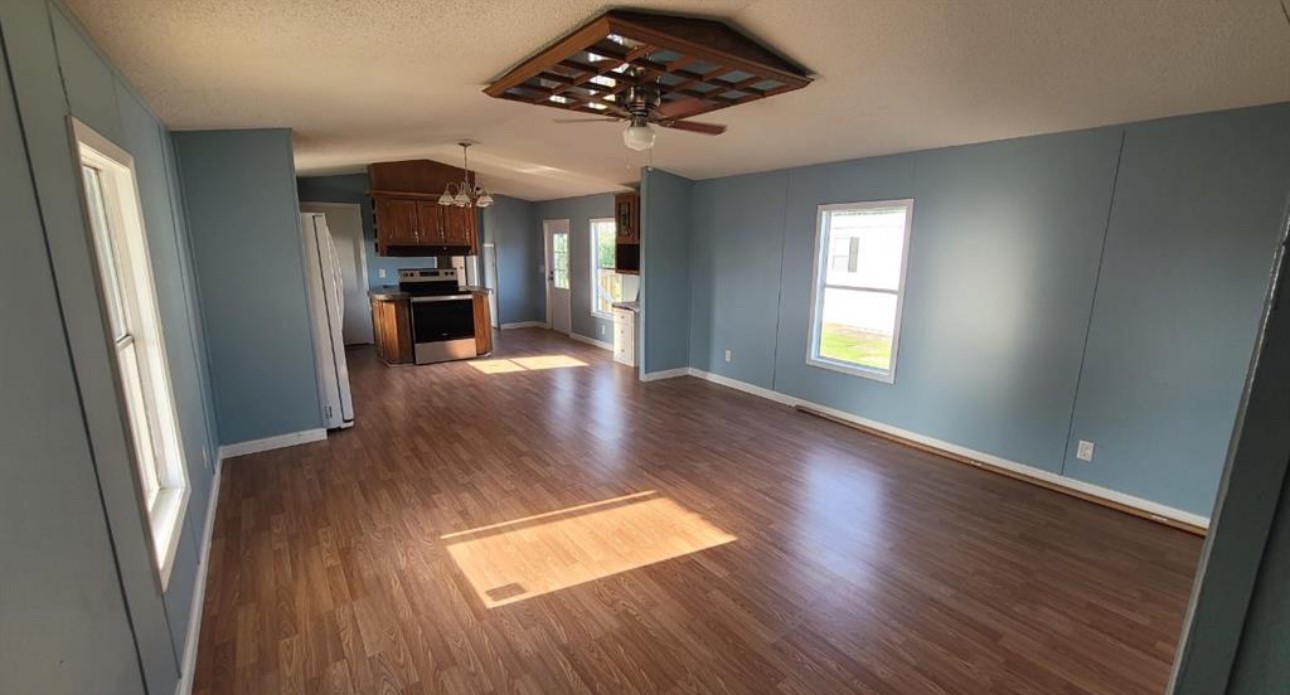 1403 Old Greens Road Houston, TX 77032 - Photo 4 of 19 wooden floor in an empty room with a window