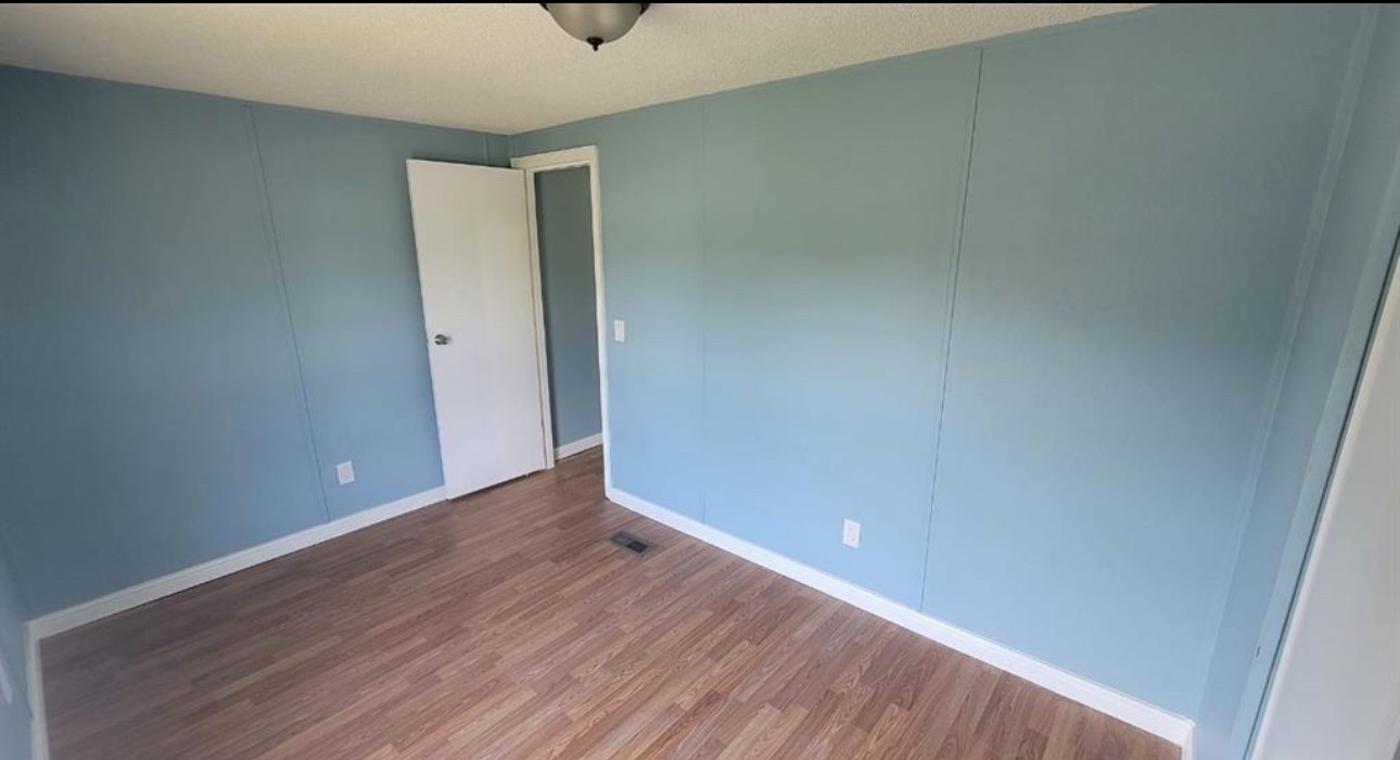 1403 Old Greens Road Houston, TX 77032 - Photo 10 of 19 a view of an empty room with wooden floor