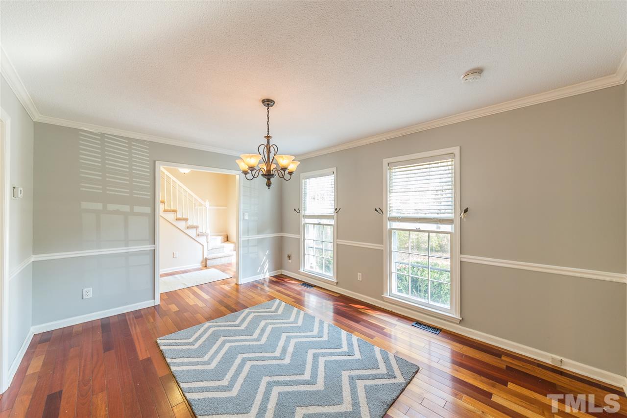 8236 Bells Lake Road Apex, NC 27539 - Photo 2 of 25 Enjoy hosting holiday meals and gatherings in your formal dining room. The large windows and easy access to the kitchen make this space ideal for meals.
