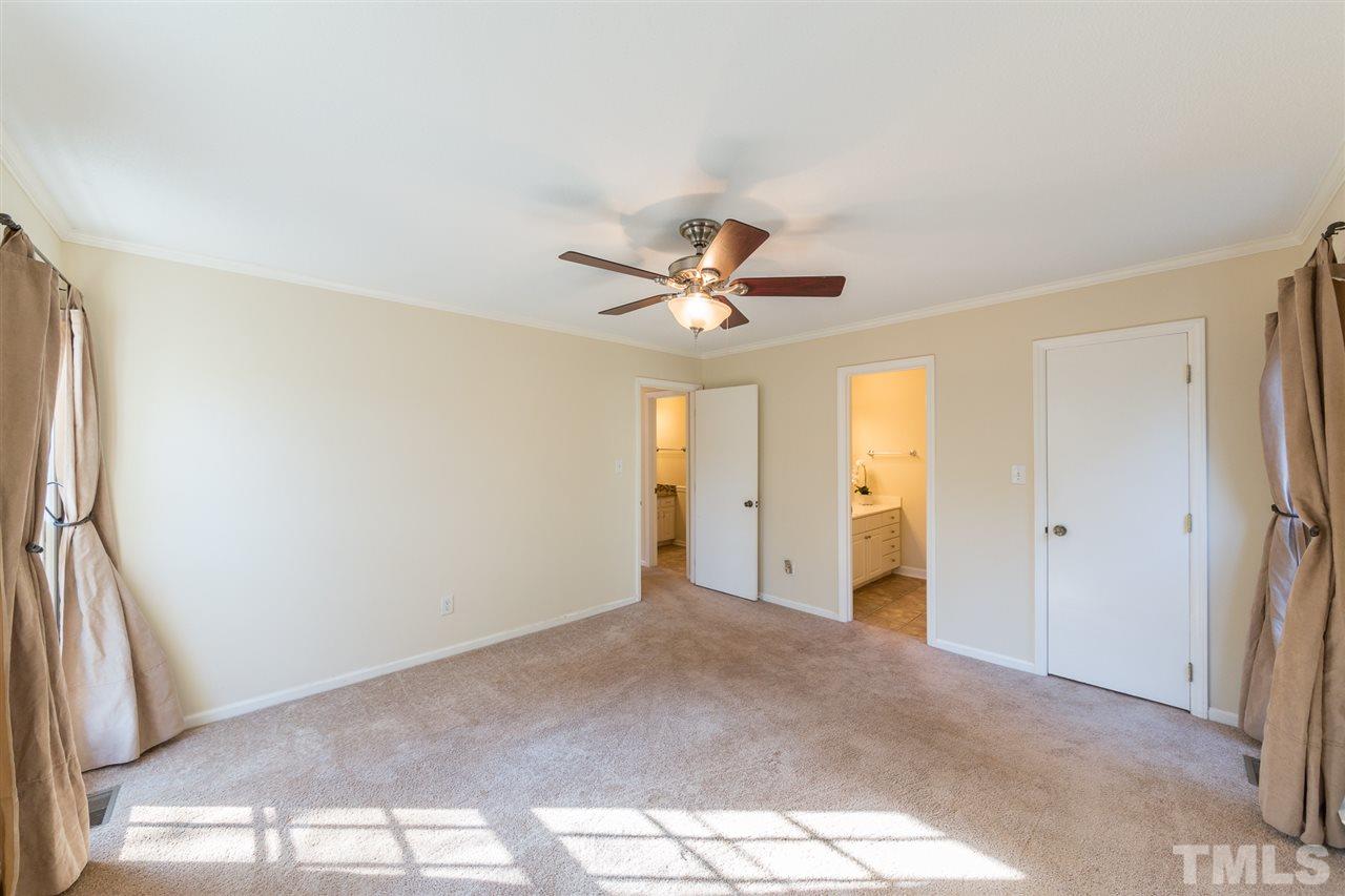 8236 Bells Lake Road Apex, NC 27539 - Photo 11 of 25 Your master bedroom connects to an en suite bathroom, with a separate shower and large vanity. A great way to begin the day.