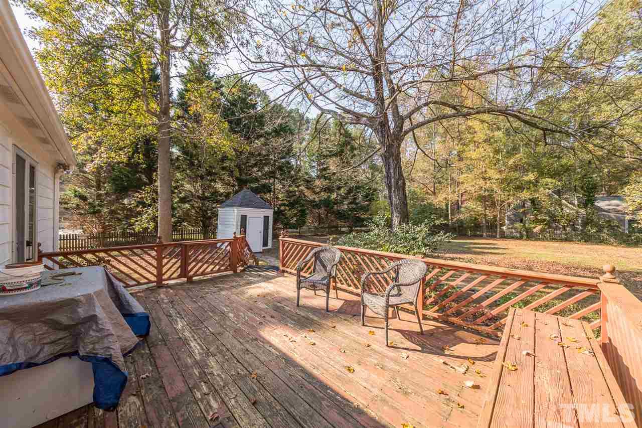 8236 Bells Lake Road Apex, NC 27539 - Photo 15 of 25 Your spacious rear deck overlooks the gorgeous rear yard. Imagine grilling for fall gatherings, entertaining, and relaxing with the surrounding natural beauty.