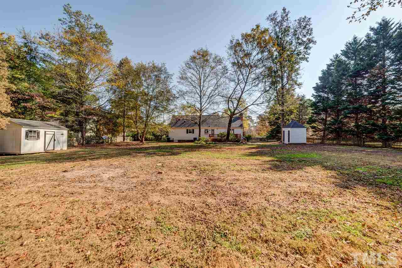 8236 Bells Lake Road Apex, NC 27539 - Photo 19 of 25 Your storage shed in the back yard is great for lawn tools and extra storage space.