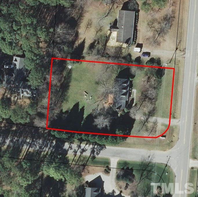 8236 Bells Lake Road Apex, NC 27539 - Photo 23 of 25 You will love the large, corner lot and privacy of the hardwood trees.