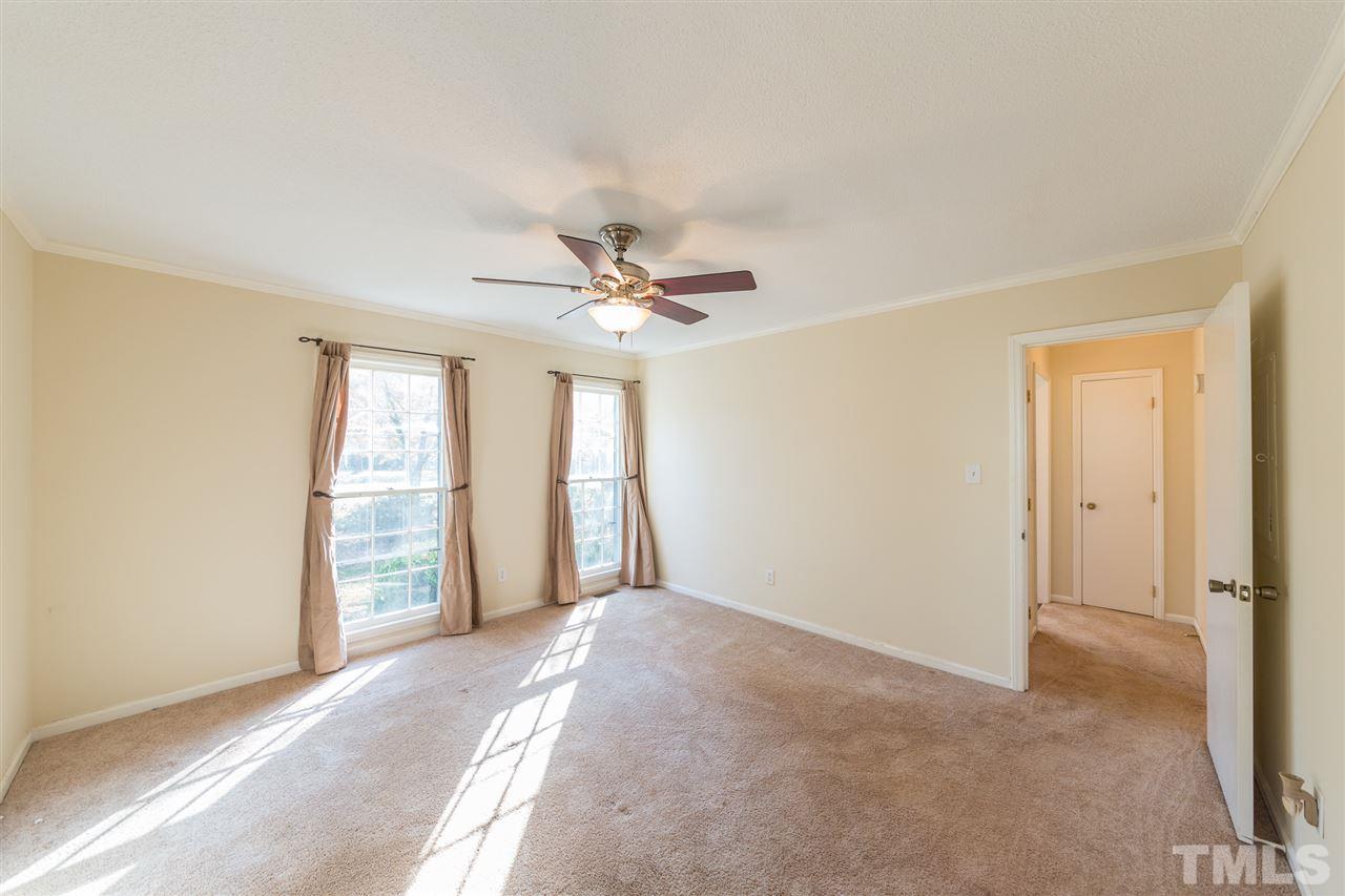 8236 Bells Lake Road Apex, NC 27539 - Photo 10 of 25 Welcome to your main floor master bedroom suite. You will love the natural light, privacy, and quiet separation from the rest of the main floor.