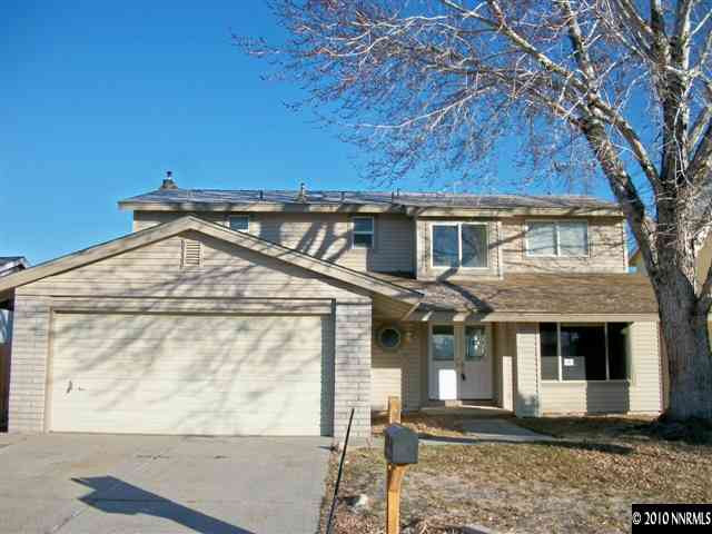 1702 Del Rosa Way Sparks, NV 89434 - Photo 1 of 11 a front view of a house with a yard