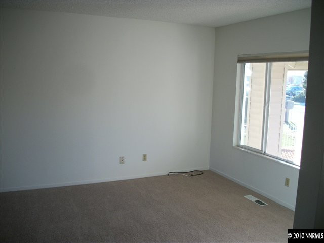 1702 Del Rosa Way Sparks, NV 89434 - Photo 3 of 11 an empty room with a window