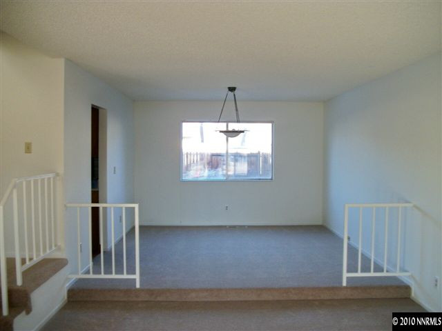 1702 Del Rosa Way Sparks, NV 89434 - Photo 4 of 11 a view of wooden floor and windows in a room