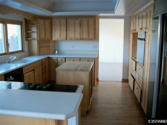 1702 Del Rosa Way Sparks, NV 89434 - Photo 6 of 11 a kitchen with stainless steel appliances a refrigerator and a sink