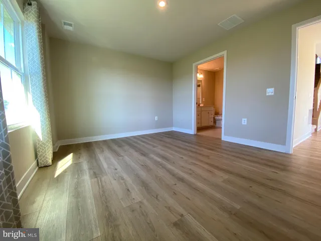 a view of a storage & utility room with closet washer and dryer