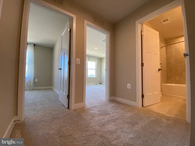 a view of an empty room with a bathroom