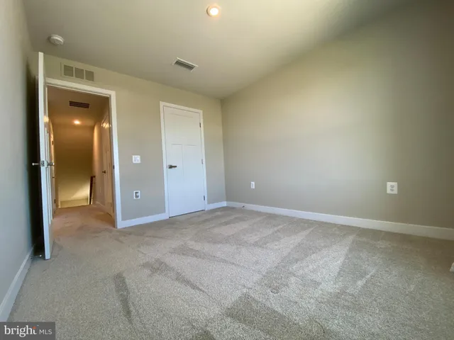 a view of swimming pool with outdoor seating and a garden