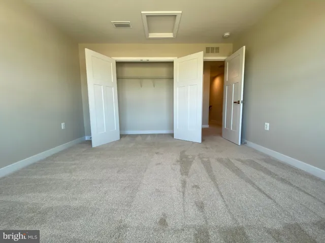 a view of a car parked in front of a house