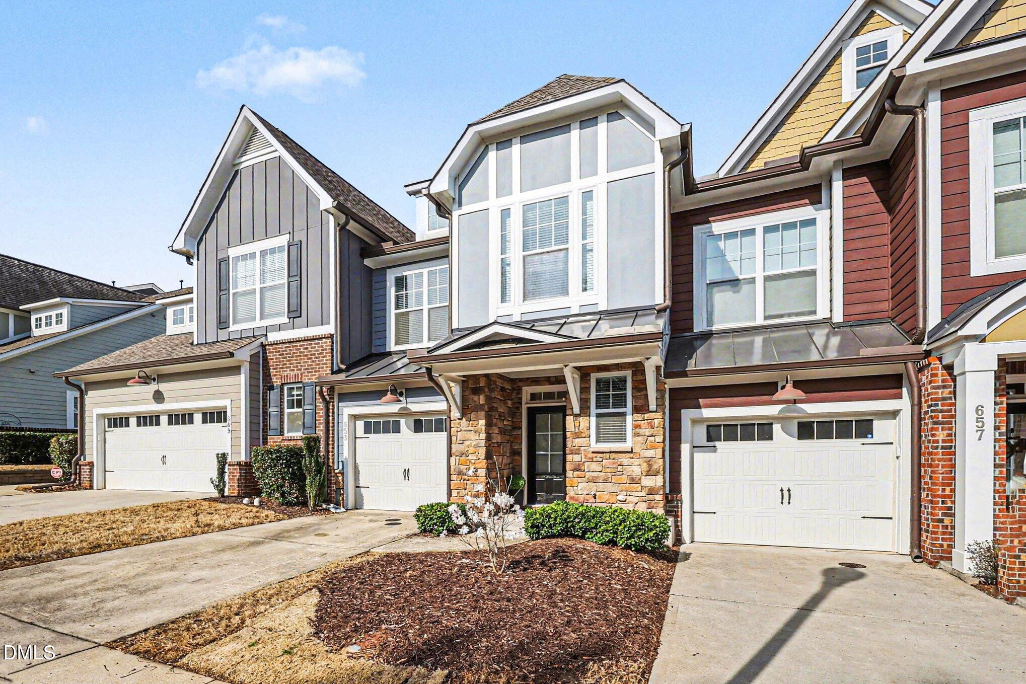 653 Fallon Grove Way Raleigh, NC 27608 - Photo 2 of 38 a front view of a house with a yard