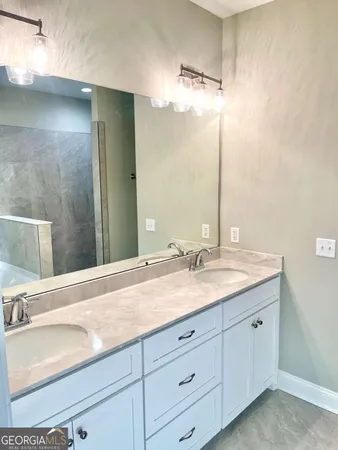 a white toilet sitting next to a shower