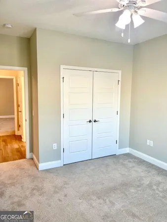 a view of a bathroom with wooden floor