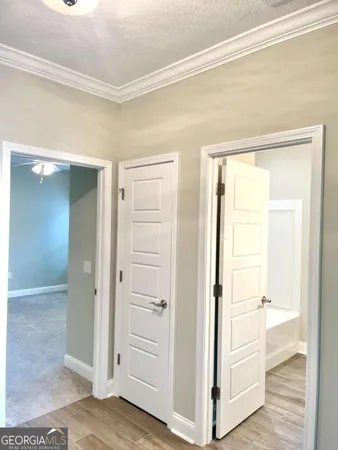 a bathroom with a granite countertop sink toilet and a mirror