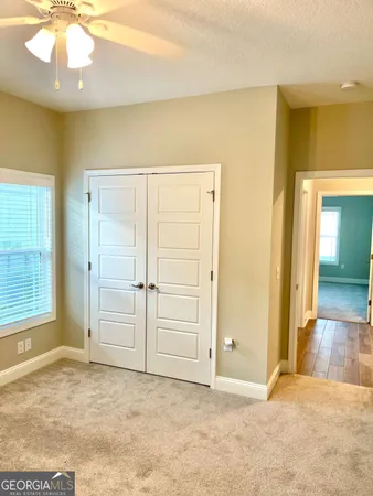 a view of kitchen view with wooden floor and stainless steel appliances