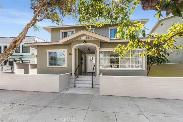 a front view of a house with a porch