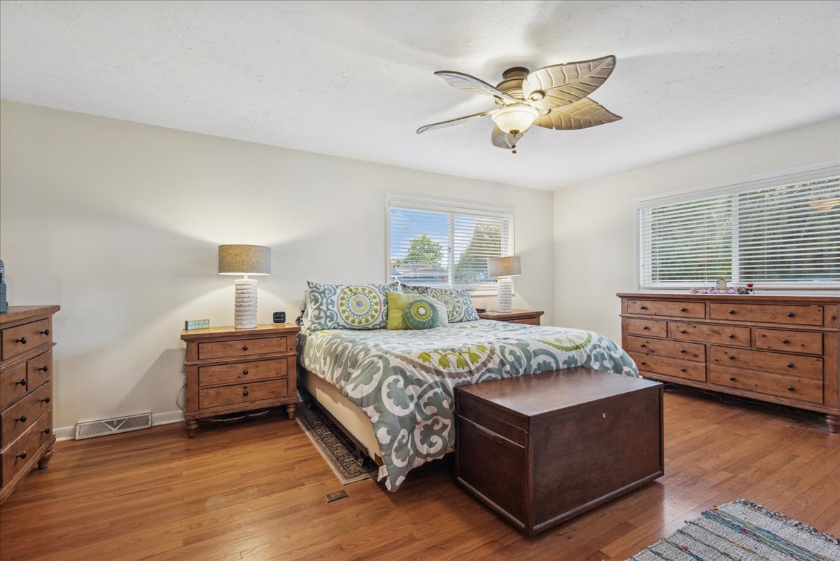 512 Busse Road Mount Prospect, IL 60056 - Photo 11 of 24 a bedroom with a bed and window