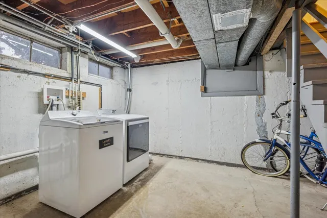 a view of a storage & utility room with a sink