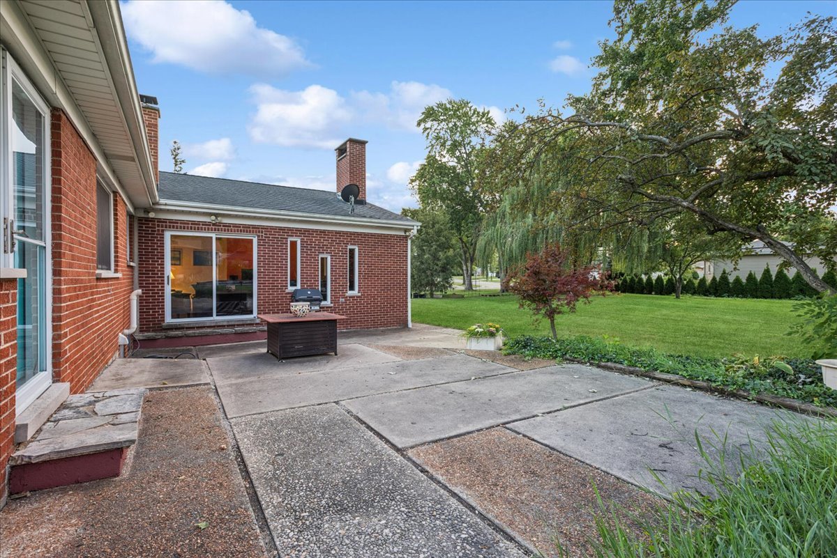 512 Busse Road Mount Prospect, IL 60056 - Photo 20 of 24 a view of a house with backyard porch and garden