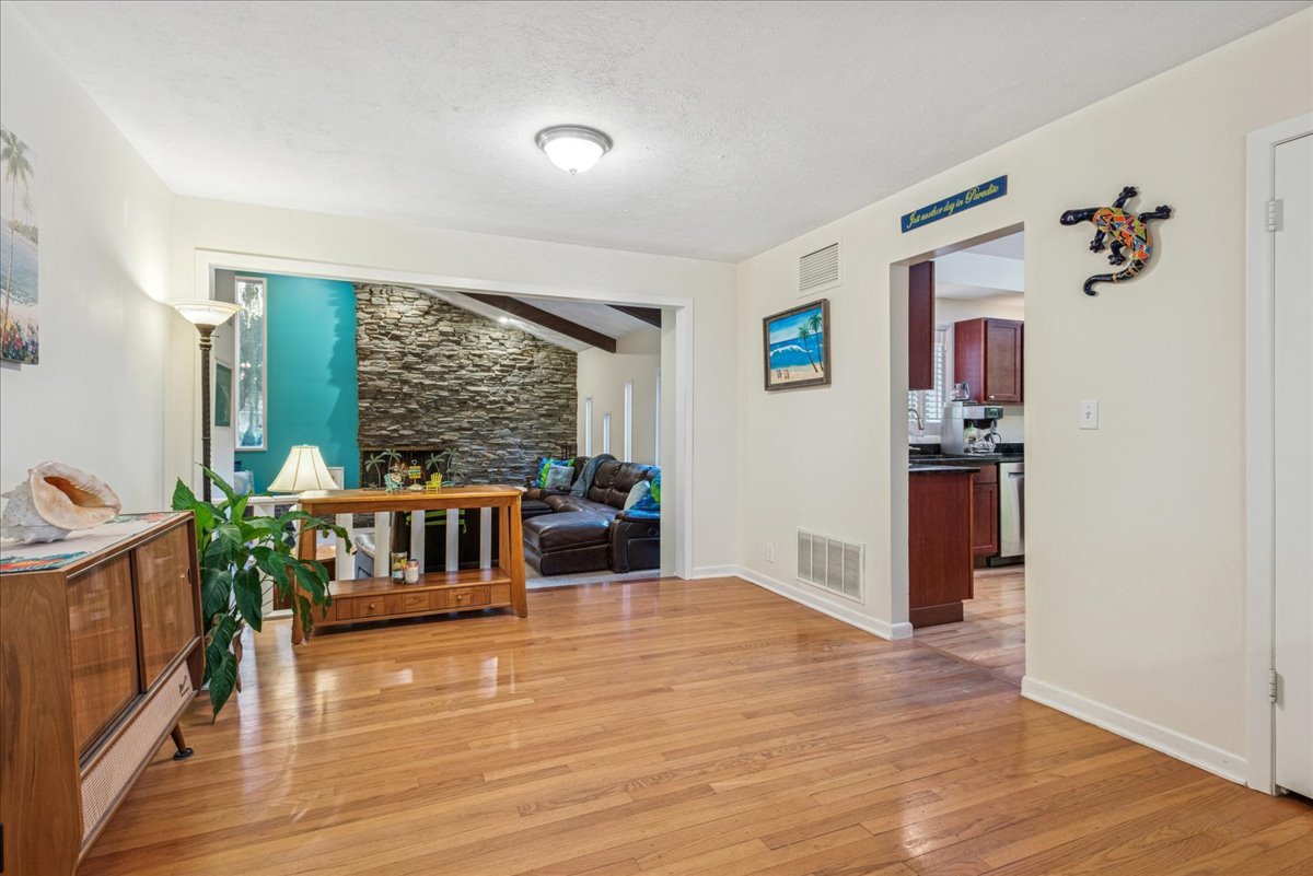 512 Busse Road Mount Prospect, IL 60056 - Photo 8 of 24 a living room with furniture and a large window