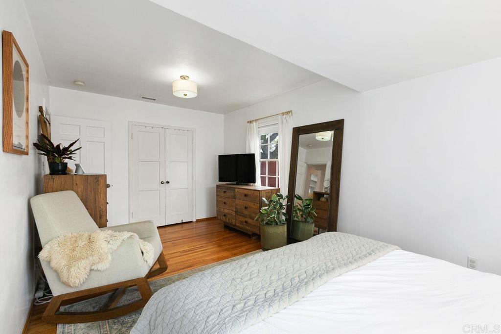 4321 Gordon Way La Mesa, CA 91942 - Photo 17 of 27 a bedroom with a bed and wooden floor