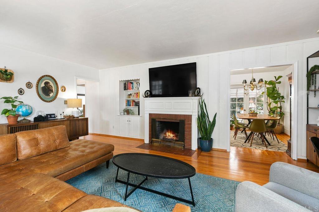 4321 Gordon Way La Mesa, CA 91942 - Photo 8 of 27 a living room with furniture a flat screen tv and a fireplace