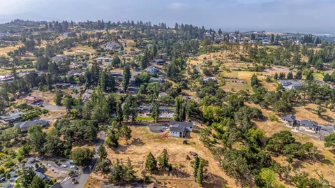 an aerial view of residential house with parking space