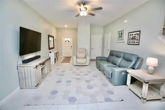 a kitchen with stainless steel appliances granite countertop a refrigerator sink and stove