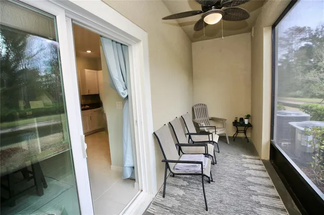 a room with furniture and chandelier