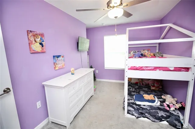 a bathroom with a granite countertop sink a toilet and a mirror