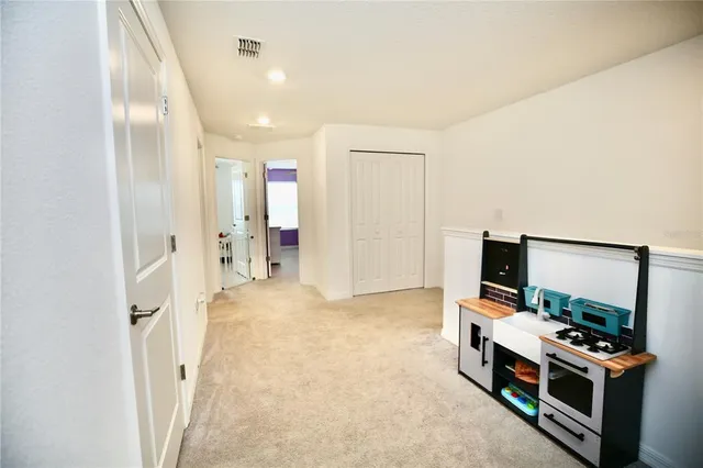 a bedroom with a bed and a night stand