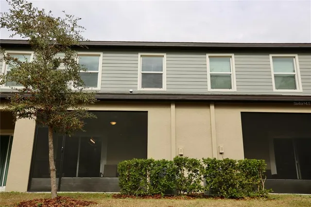 a view of swimming pool with outdoor seating and plants