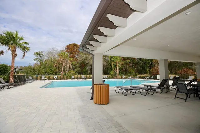 front view of a brick house with a large window