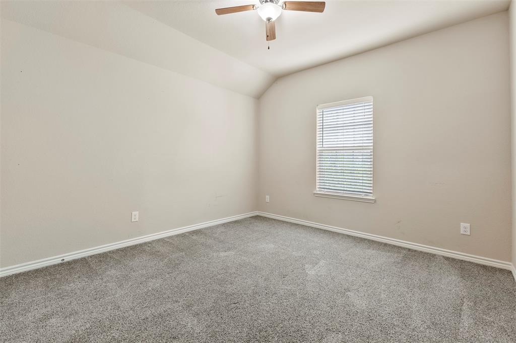 6522 Portside Ridge Lane Dallas, TX 75249 - Photo 24 of 37 Carpeted room featuring a ceiling fan with light fixture, window with blinds, and neutral wall tones