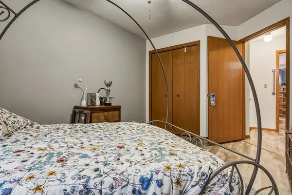 a bedroom with a bed and a dresser
