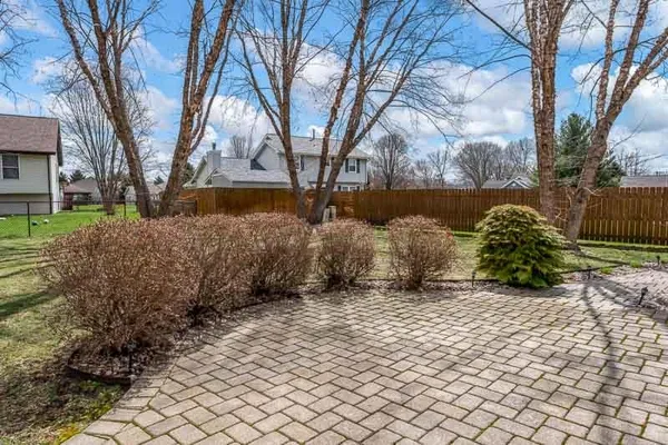 a view of a backyard of the house