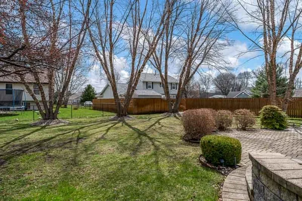 a backyard of a house with lots of green space
