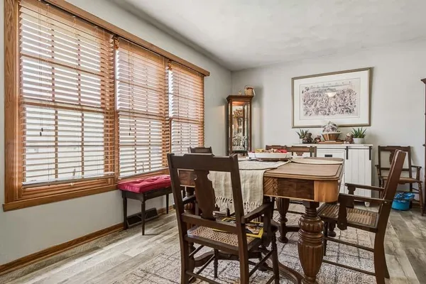 a view of a dining room with furniture and window