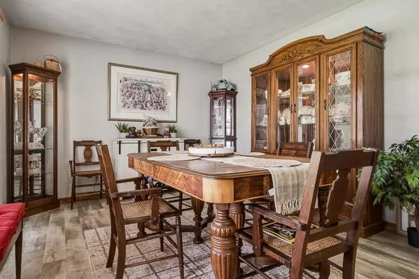 a view of a dining room with furniture and window