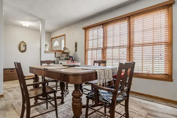 a view of a dining room with furniture and window