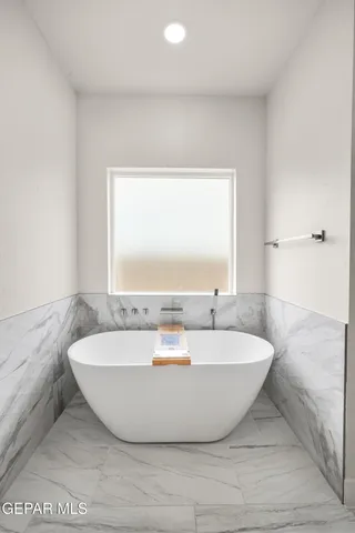 a bathroom with a sink a mirror and a shower