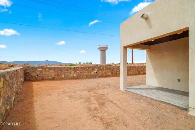 a view of a kitchen with a sink and cabinets