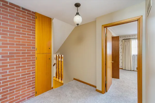 a view of empty room with ceiling fan
