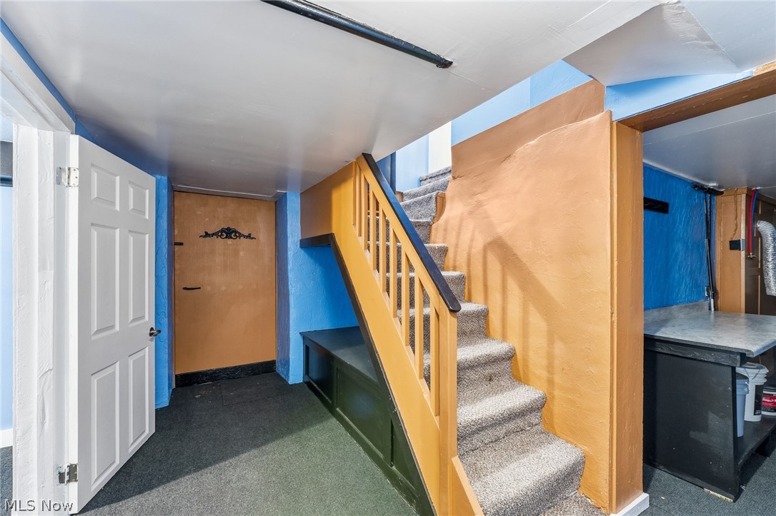 563 Geneva Avenue Struthers, OH 44471 - Photo 21 of 31 Stairs featuring carpet floors and baseboards