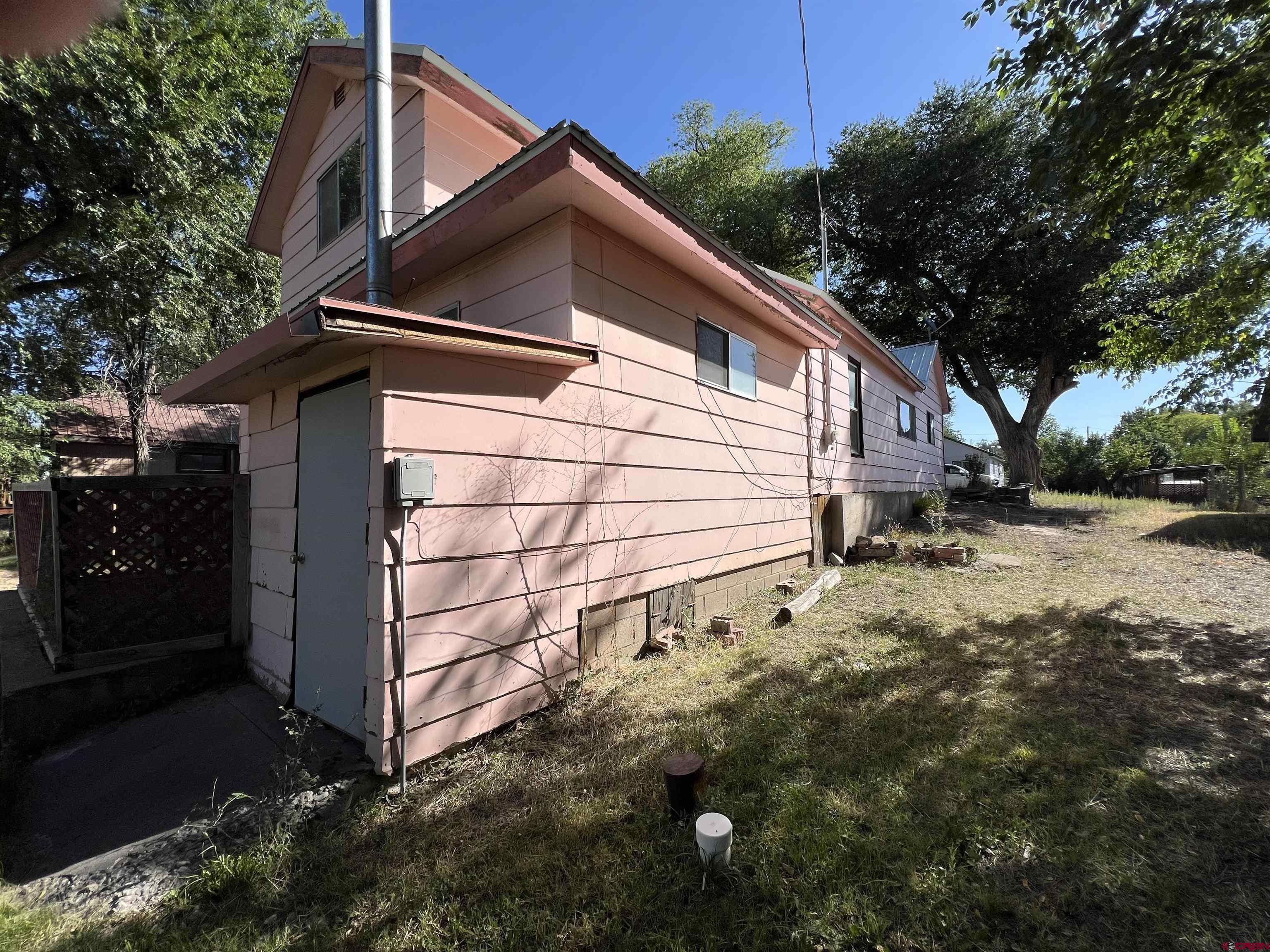 460 Fox Street Nucla, CO 81424 - Photo 11 of 35 a view of a house with a yard
